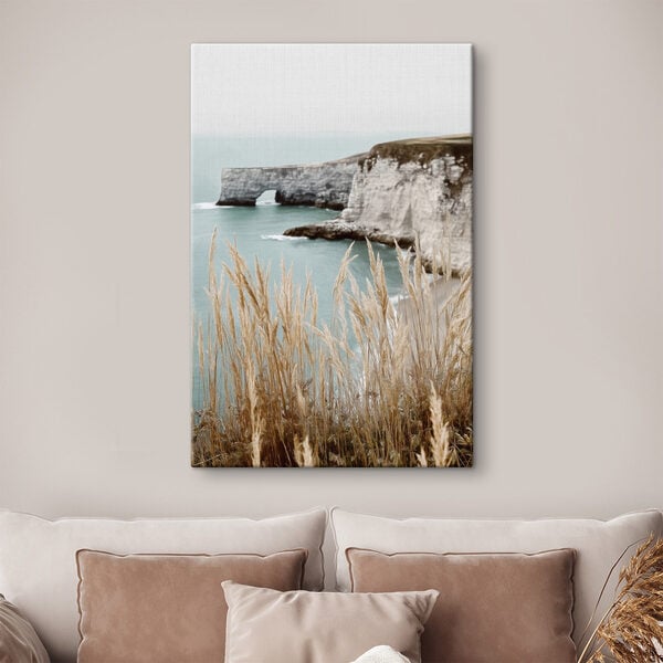 Tall grass next to a body of water