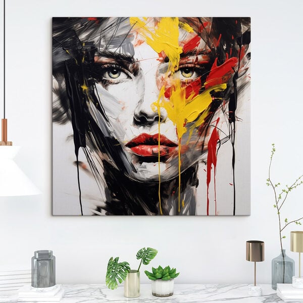 Painting of a woman's face with red yellow and black paint