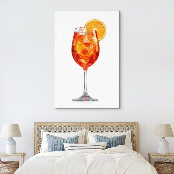 Glass of orange drink with ice and a slice of orange