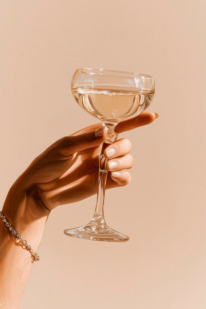 Hand holding a glass of wine