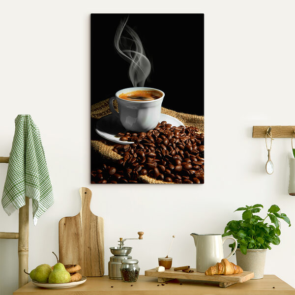 A cup of coffee with smoke on a saucer and beans